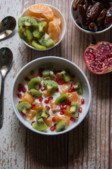 Homemade fresh fruit salad in a white bowl. Close up.