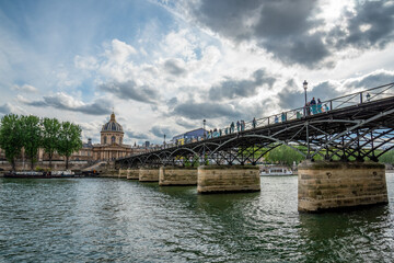 Fototapeta na wymiar Pont des Arts and the Institut de Fance in the background, Paris