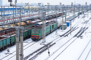 Freight railway station with locomotives in winter.