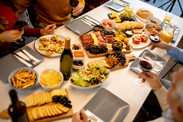 Father having breakfast with his son and daughter at home, closeup on the food