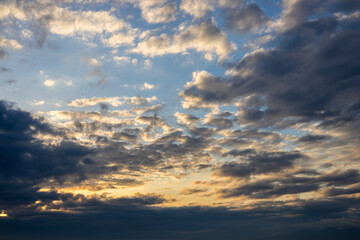 heaven at sunrise, slight yellow staining of the sky. cloudy sky