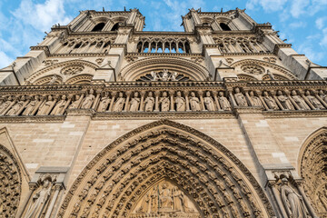Beautiful portal of the famous Notre Dame Cathedral in Paris before the fire