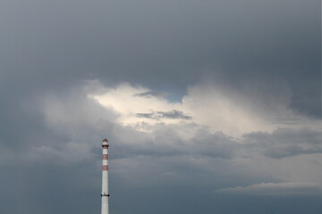 Lighthouse in the cloudy sky