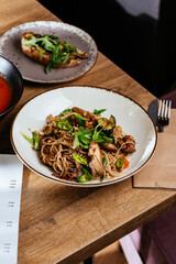 wheat noodles with chicken in Asian style
