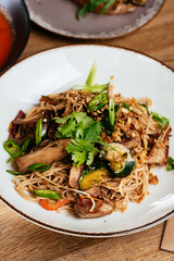 wheat noodles with chicken in Asian style