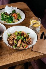 wheat noodles with chicken in Asian style