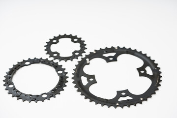 Gears, sprockets and chain of a mountain sports bike on a white background. Bicycle parts