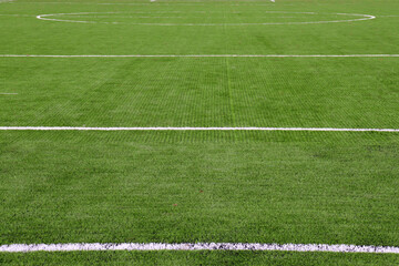 Fototapeta premium Soccer field with lines. Green grass texture