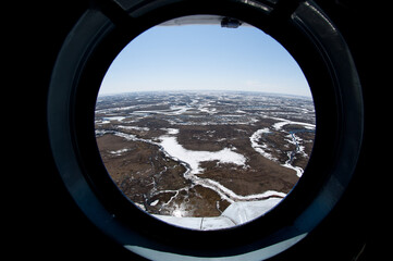 Fototapeta premium spring tundra in the porthole