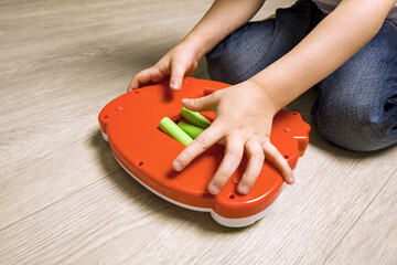 child hand paste batteries in toy