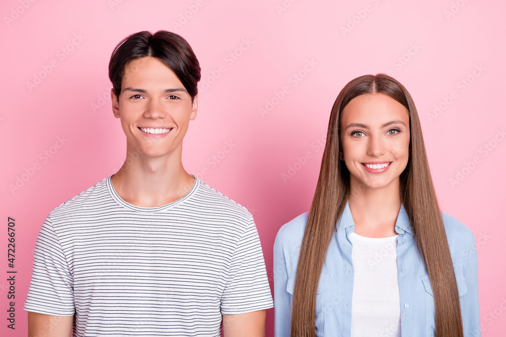 Poster Photo of charming pretty young couple wear casual clothes smiling isolated pink color background