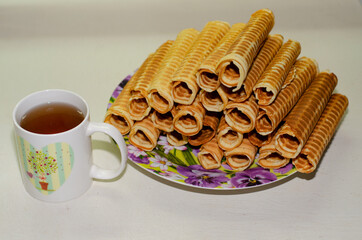 fresh waffles for tea rolled into a tube