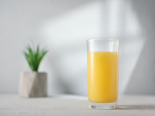 Glass of orange juice on the table