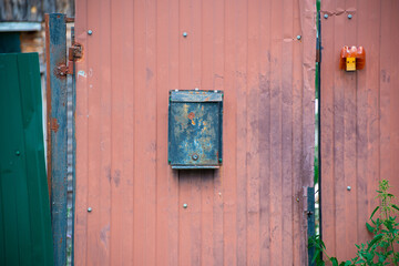 a letter box on the fence at home