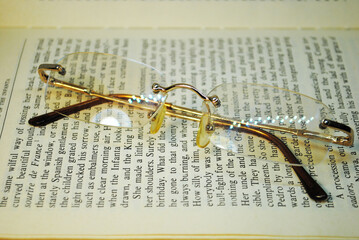 Glasses placed on an open book