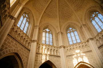 Trebon, South Bohemia, Czech Republic, 9 October 2021: Schwarzenberg family tomb at gothic style in Domanin near castle, Church interior, white stone walls, lancet windows with stained-glass