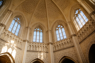 Trebon, South Bohemia, Czech Republic, 9 October 2021: Schwarzenberg family tomb at gothic style in Domanin near castle, Church interior, white stone walls, lancet windows with stained-glass