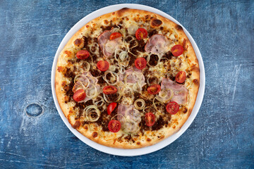 fresh pizza on the white plate