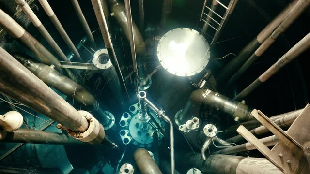 A fuel rod being inserted in a reactor vessel at the nuclear power plant.