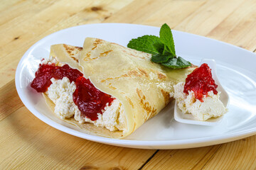 Pancake with cottage cheese and jam