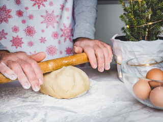 Handsome man preparing a healthy breakfast. Closeup, indoors. Day light, studio photo. Concept of care pet and healthy, delicious food