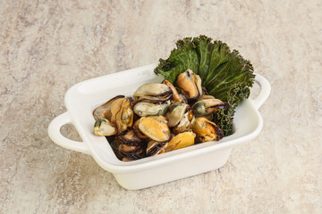 Tasty marinated mussels in the bowl