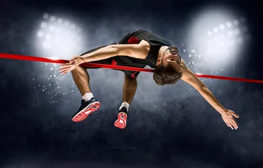 Gordijnen Man in action of high jump © Andrey Burmakin