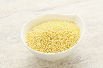 Raw couscous in the bowl