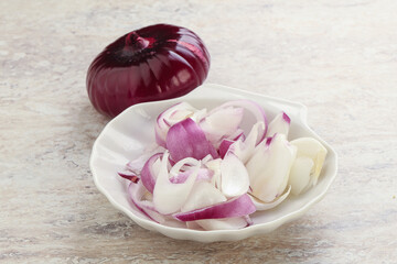 Sliced red onion in the bowl
