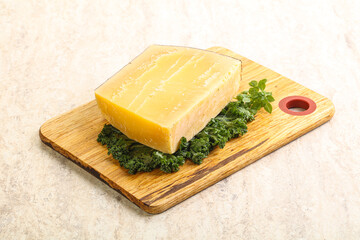 Parmesan cheese piece over board