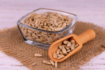 Sunflower seeds in a glass bowl.
Close-up.