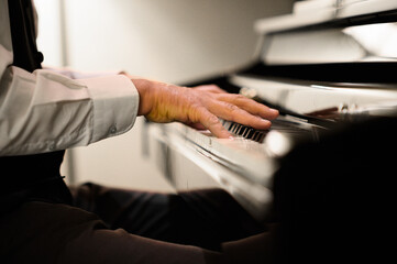 Closeup of a musician playing the piano