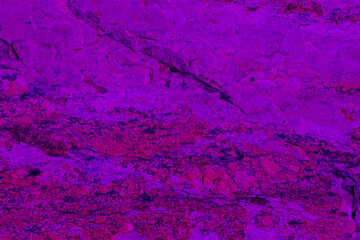 Abstract stone background. Trendy classic pink color. Rock surface with cracks.