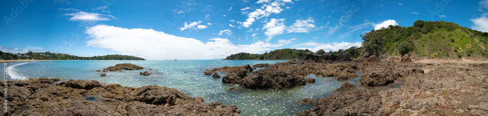 Wall mural panorama of stone seashore and blue sea new zealand