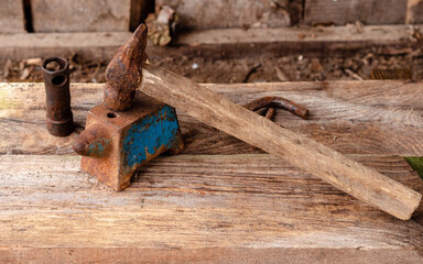 An old hammer and anvil in the workshop