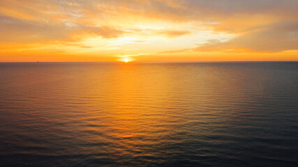 Obraz premium Beautiful sunset over sea, aerial view. Evening seascape, drone photography.