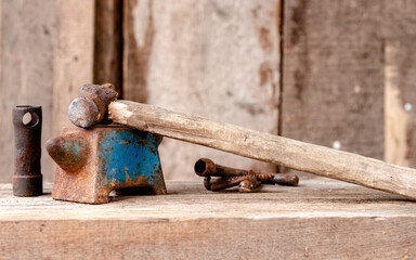 An old hammer and anvil in the workshop