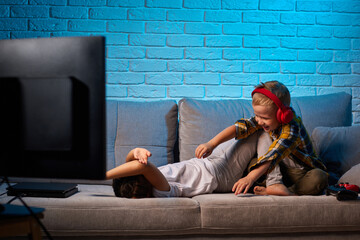 cheerful boy and girl having fun at home together