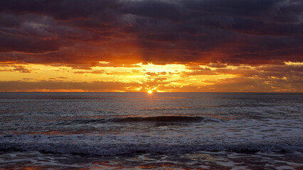 sunset under a grey sky in italy