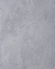 Gray irregular surface for background, possibly paper or plastic