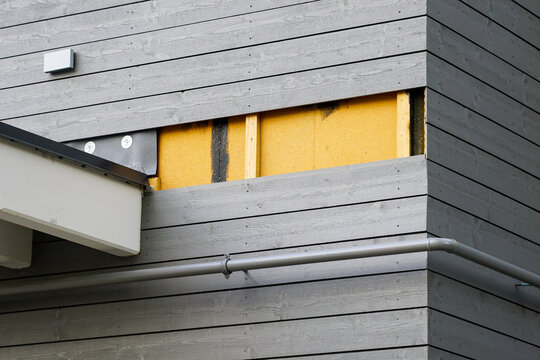 A Fragment Of A Wooden House Facade, Thermal Insulation Material, Wooden Laths And Cladding Boards