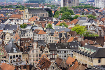 Fototapeta na wymiar Aerial view of Ghent from Belfry - roofs and beautiful medieval buildings. Ghent is a city and a municipality located in the Flemish region of Belgium. Ghent, Belgium.