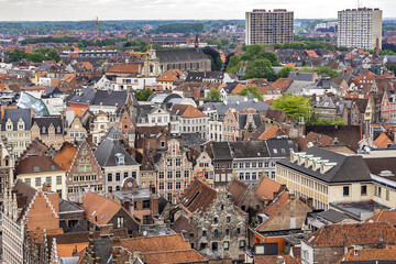 Fototapeta na wymiar Aerial view of Ghent from Belfry - roofs and beautiful medieval buildings. Ghent is a city and a municipality located in the Flemish region of Belgium. Ghent, Belgium.