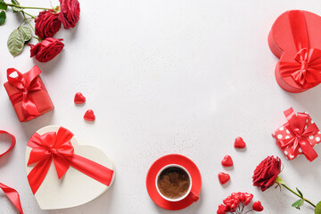 Valentine's day coffee, red gifts and red roses on white background. Romantic greeting card for dating. View from above. Copy space.