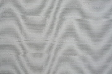 gray horizontal lines from plaster.
decorative finishing of premises.
handmade