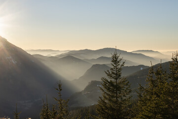 the sun is setting over the Austrian alps