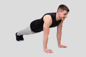 Fototapeta na wymiar Sport man Standing in Plank. Sportsman Plank Exercise
