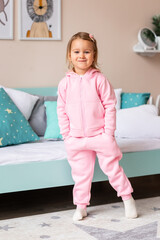 Cute little girl posing in a costume in her room