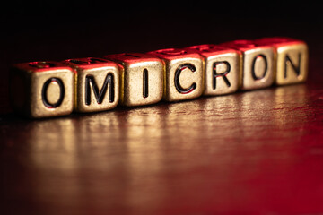 SARS-CoV-2 Coronavirus Variant Omicron. OMICRON name reveal. Red and black background.