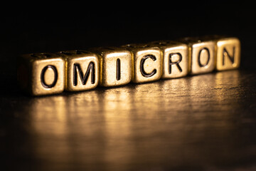 SARS-CoV-2 Coronavirus Variant Omicron. OMICRON name reveal. Red and black background.